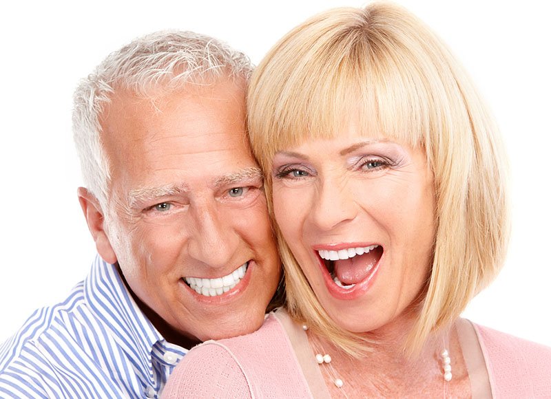 Senior couple with big white smiles