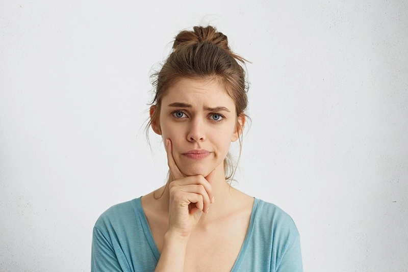 woman wondering about endodontist dentist visit