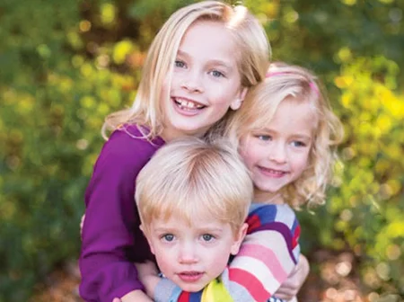 Children smiling at the dentist