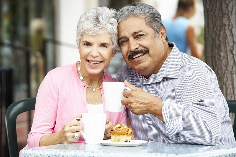 Senior Couple Enjoying Snack Outside