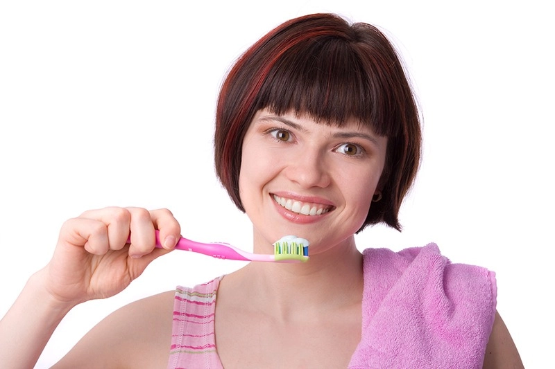 Woman Cleaning Her Teeth
